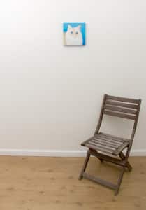Pet portrait of a french bulldog by artist Erica Eriksdotter and a chair